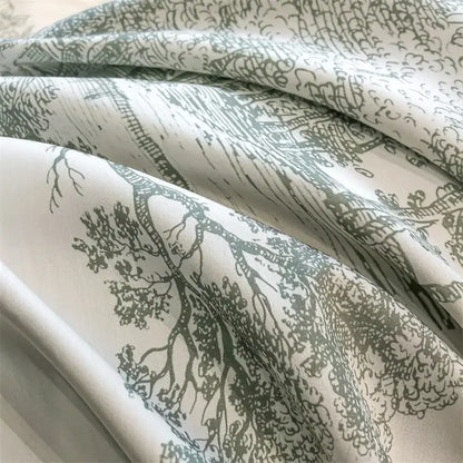 White duvet cover with delicate hand drawn sage green tree and landscape pattern made from silky eucalyptus fiber