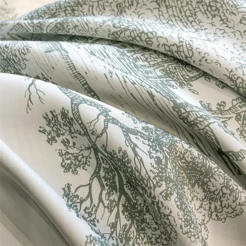 White duvet cover with delicate hand drawn sage green tree and landscape pattern made from silky eucalyptus fiber