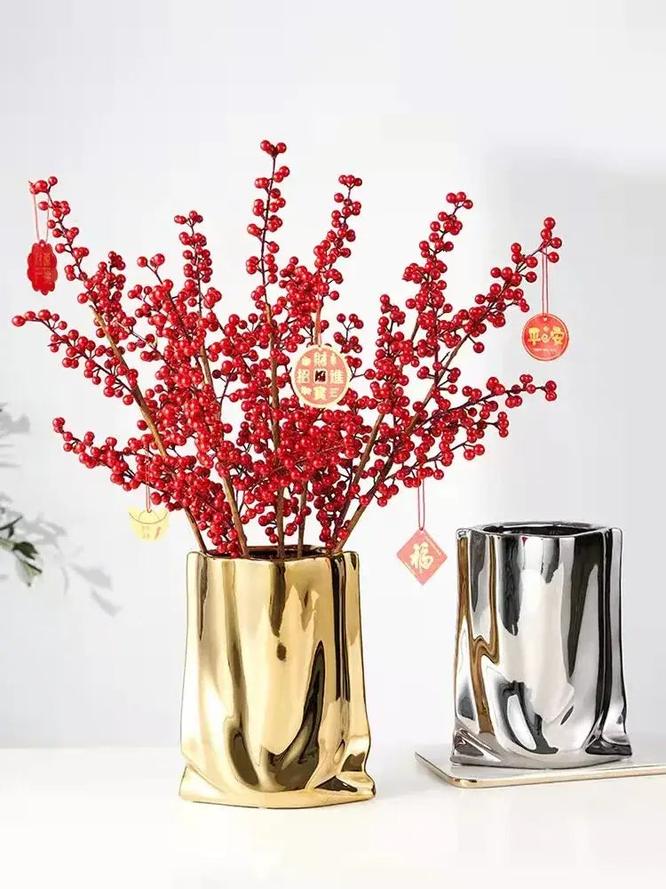 DecorBites silver ruffled flower vase in metallic gold textured ceramic holding red berry branches with festive ornaments