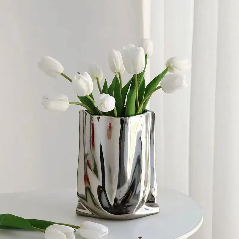 Decorbites™ silver ruffled ceramic flower vase with sleek angular design holding white tulips
