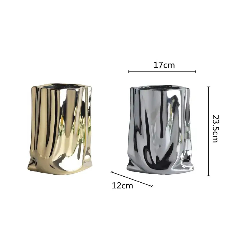Two metallic ribbed vases in gold and silver with glossy finish and silver ruffled flower vase bark-like texture