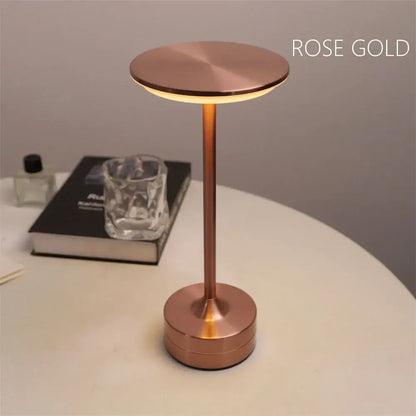 Rose gold minimalist desk lamp with simple charging LED touch control and cylindrical base for restaurant bar use