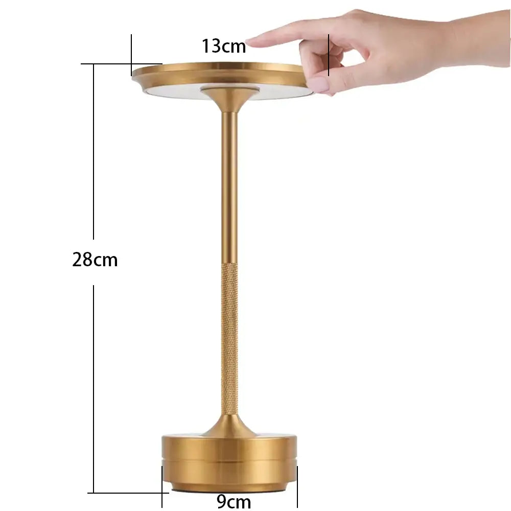 Gold-finished decorbites™ simple charging led desk lamp with circular top and textured stem for modern workspace lighting