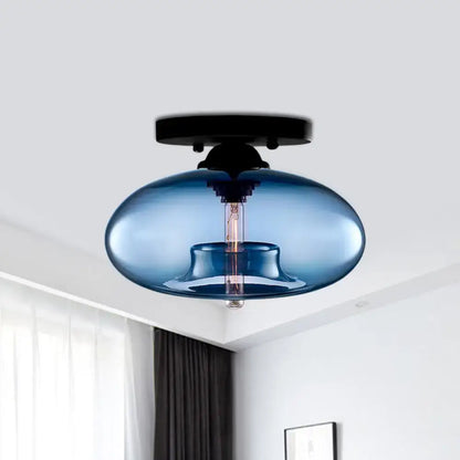 Blue translucent glass oval flush mount pendant light with black metal ceiling mount for hallway by DecorBites