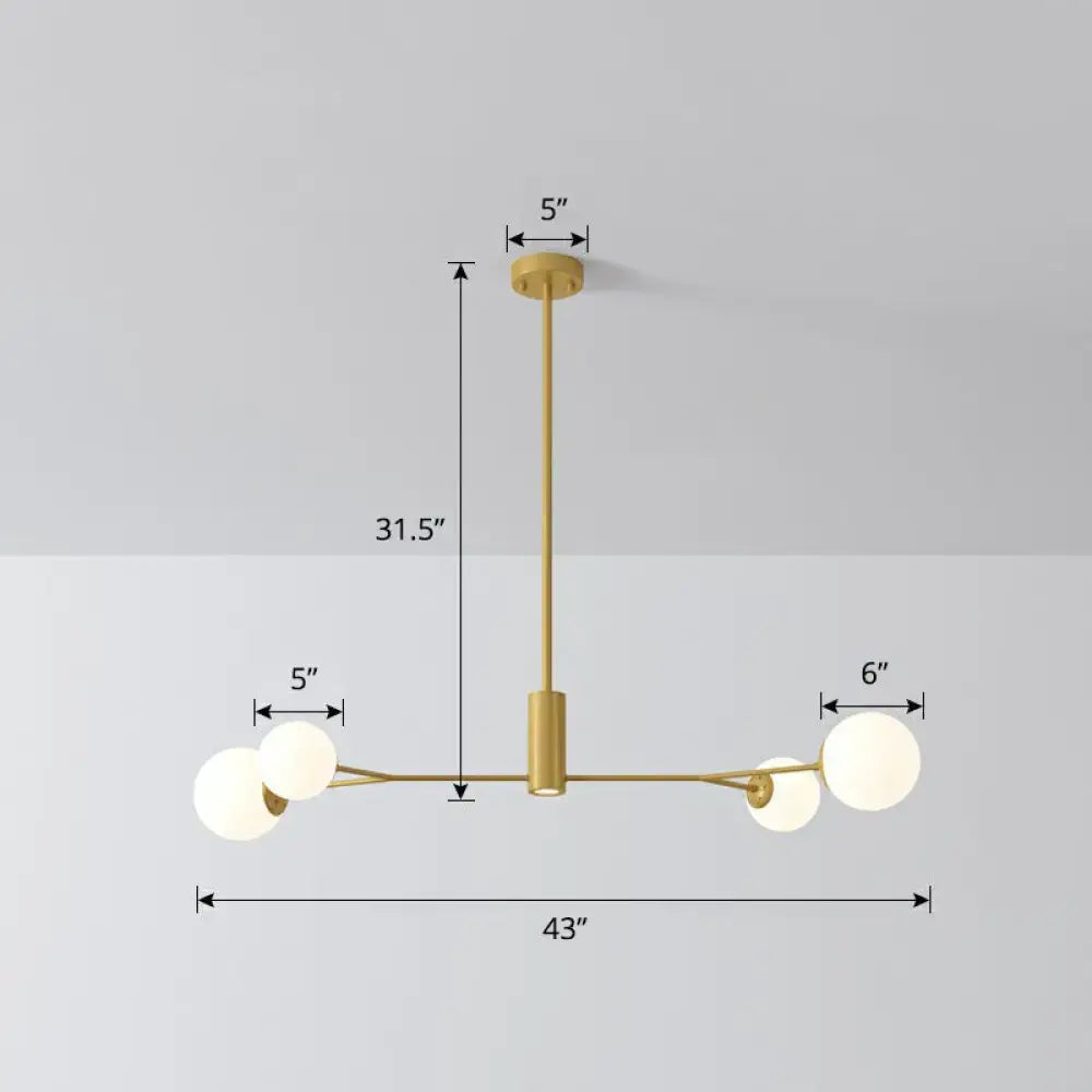 Modern gold-toned molecular island ceiling chandelier with four opal glass globe lights for dining rooms by DecorBites