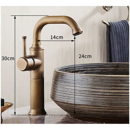 DecorBites single handle antique brass bathroom faucet with curved spout and cylindrical base in brass bathroom finish