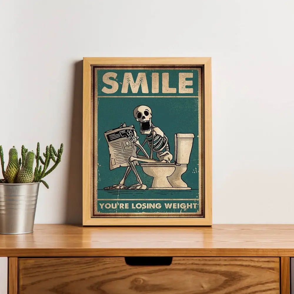 Framed teal canvas wall art by decorbites featuring a skeleton man squatting on a toilet reading a newspaper with text