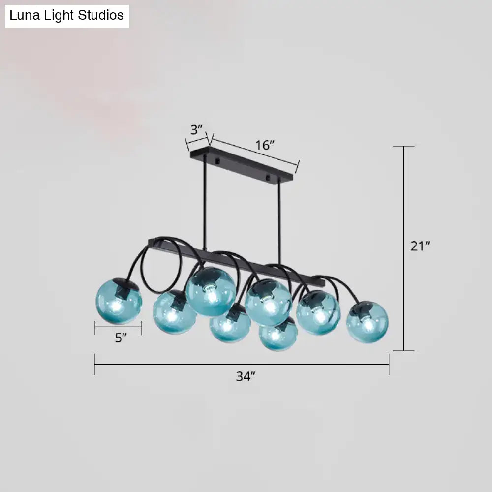 Decorbites sleek black glass sphere island light featuring a modern blue glass globe with 220v-240v bulb base
