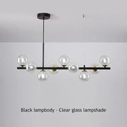 Black metal decorbites™ sleek glass ball chandelier with clear glass globe shades for dining room lighting