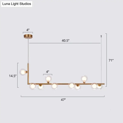 DecorBites™ gold-toned pendant light with seven glass bulbs and sleek linear design for dining room hanging island