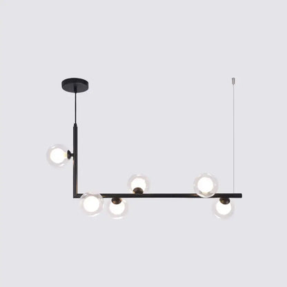 Modern black metal pendant light with five clear glass globe bulbs for dining room hanging island decor by DecorBites™