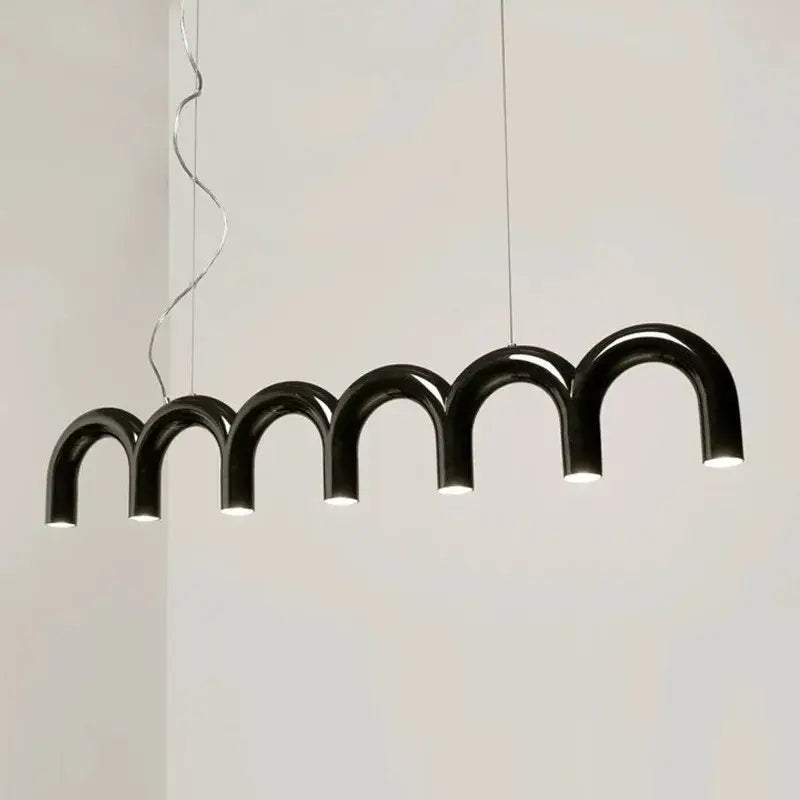 Black arched pendant light with warm glow in decorbites™ sleek u-shaped chandelier for modern bedroom and kitchen use