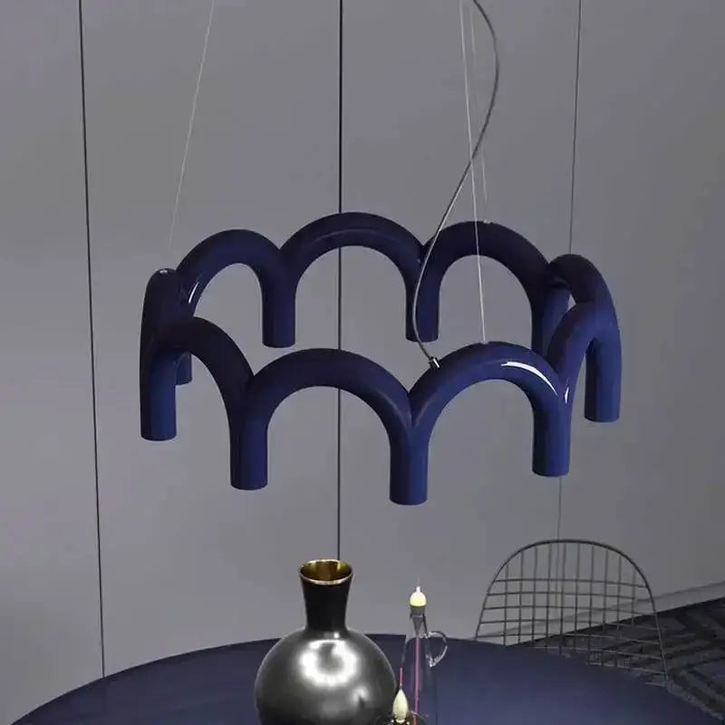 Deep blue glossy modern u-shaped chandelier by DecorBites with sculptural wave design for bedroom and kitchen