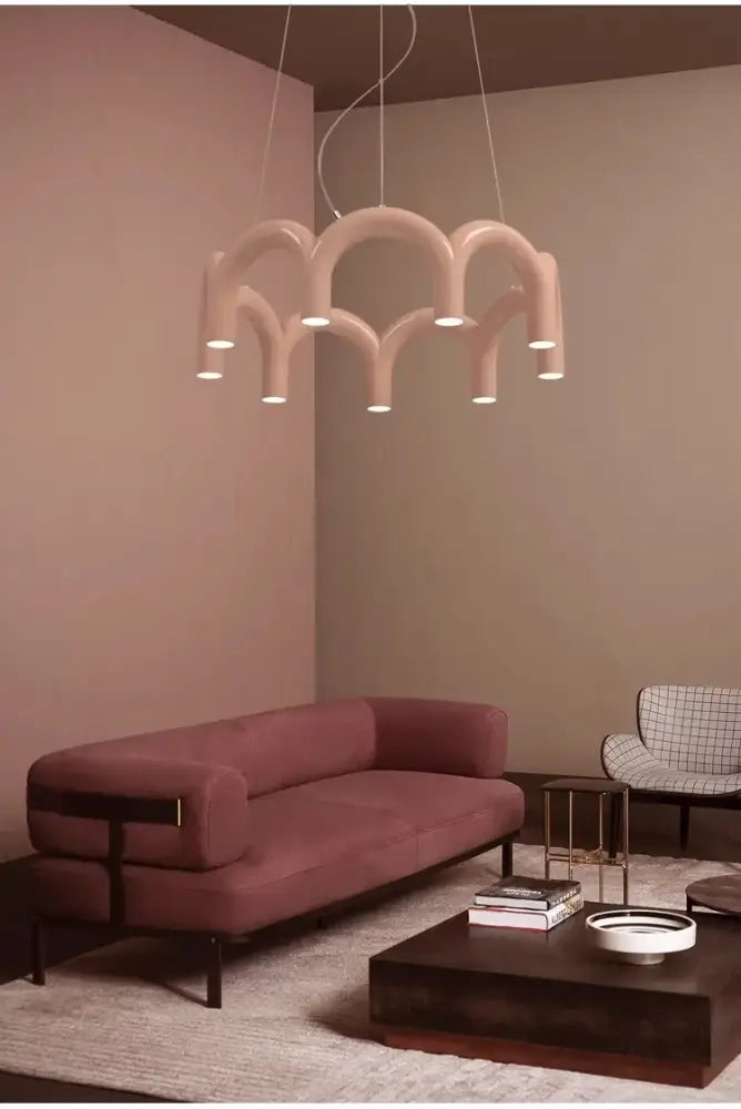 DecorBites™ sleek blush-pink modern u-shaped chandelier with sculptural arched design and integrated LED bulbs for bedroom and kitchen