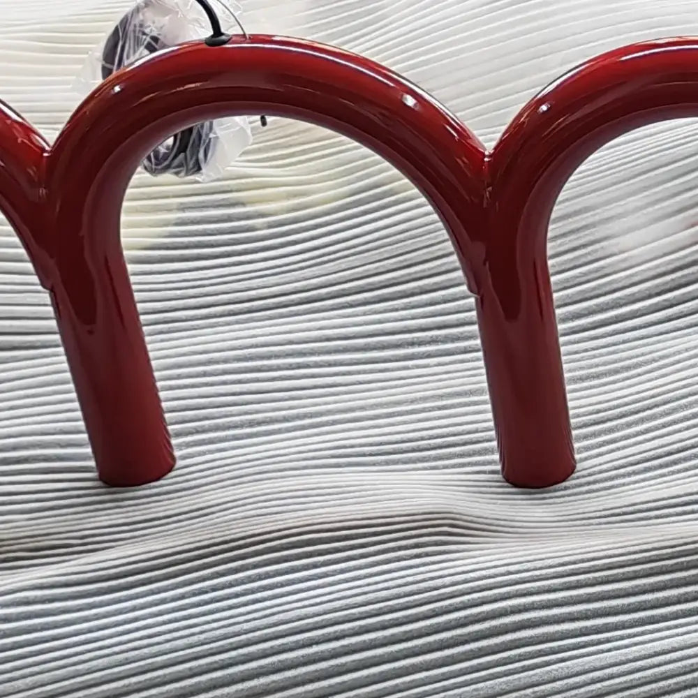 Red glossy metal u-shaped hooks of the DecorBites™ sleek modern u-shaped chandelier for bedroom and kitchen use