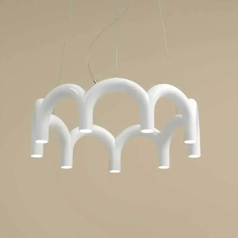 White modern u-shaped chandelier by DecorBites with sculptural interconnected tubes for bedroom and kitchen lighting