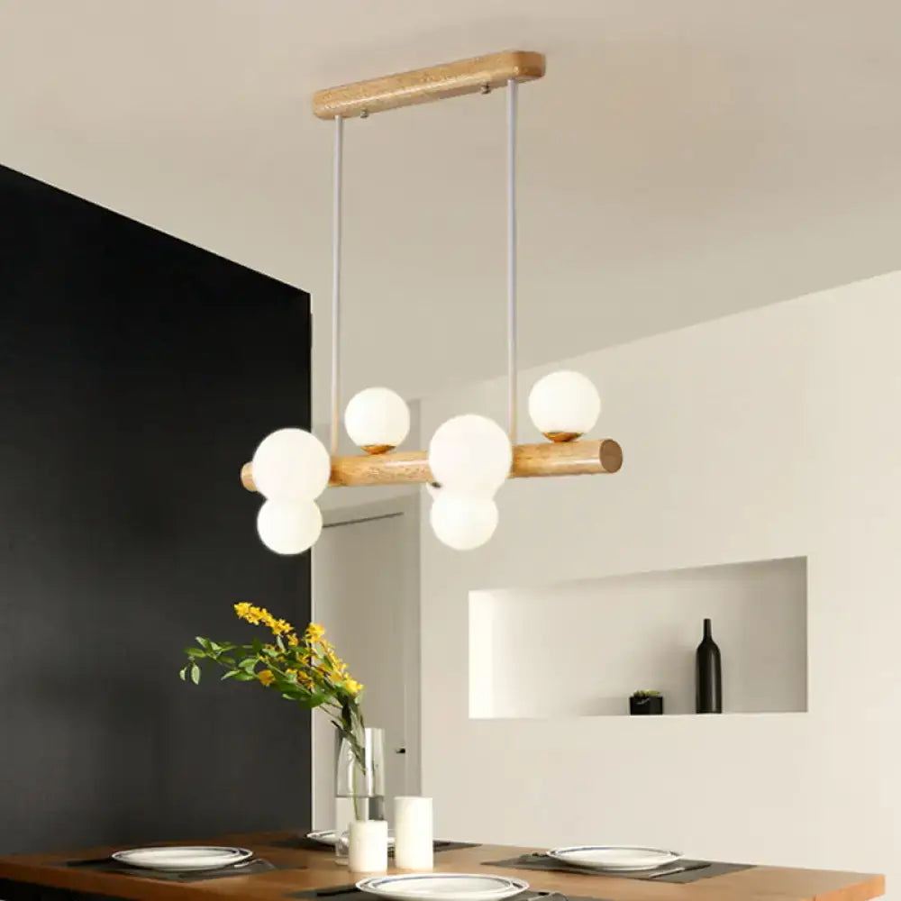 Modern wooden ceiling light with cream glass shade featuring frosted globe bulbs for dining room island chandelier