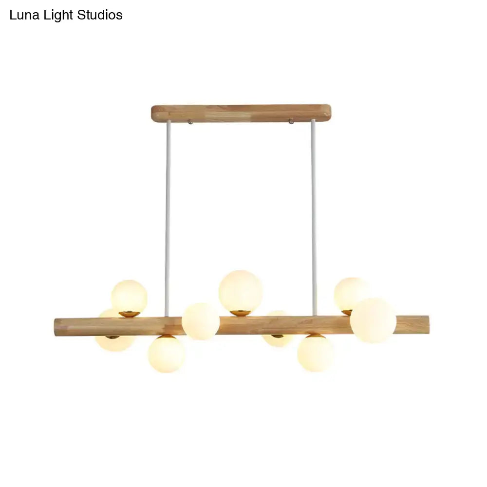 Modern decorbites ceiling light with natural wood frame cream glass shade and white metal rods for dining room use