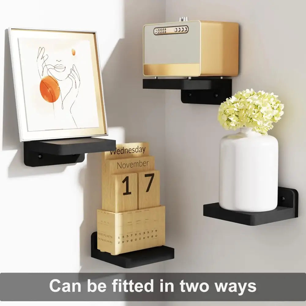 Black wood decorbites small floating shelves 4-pack wall mounted holding framed art calendar blocks and white vase with hydrangeas