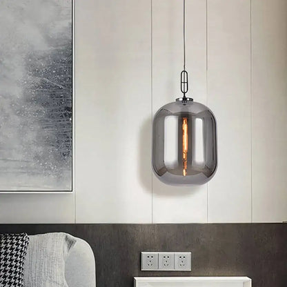 Decorbites™ smoke gray cognac glass pendant lamp with sleek smoked glass cylindrical design and visible filament bulb