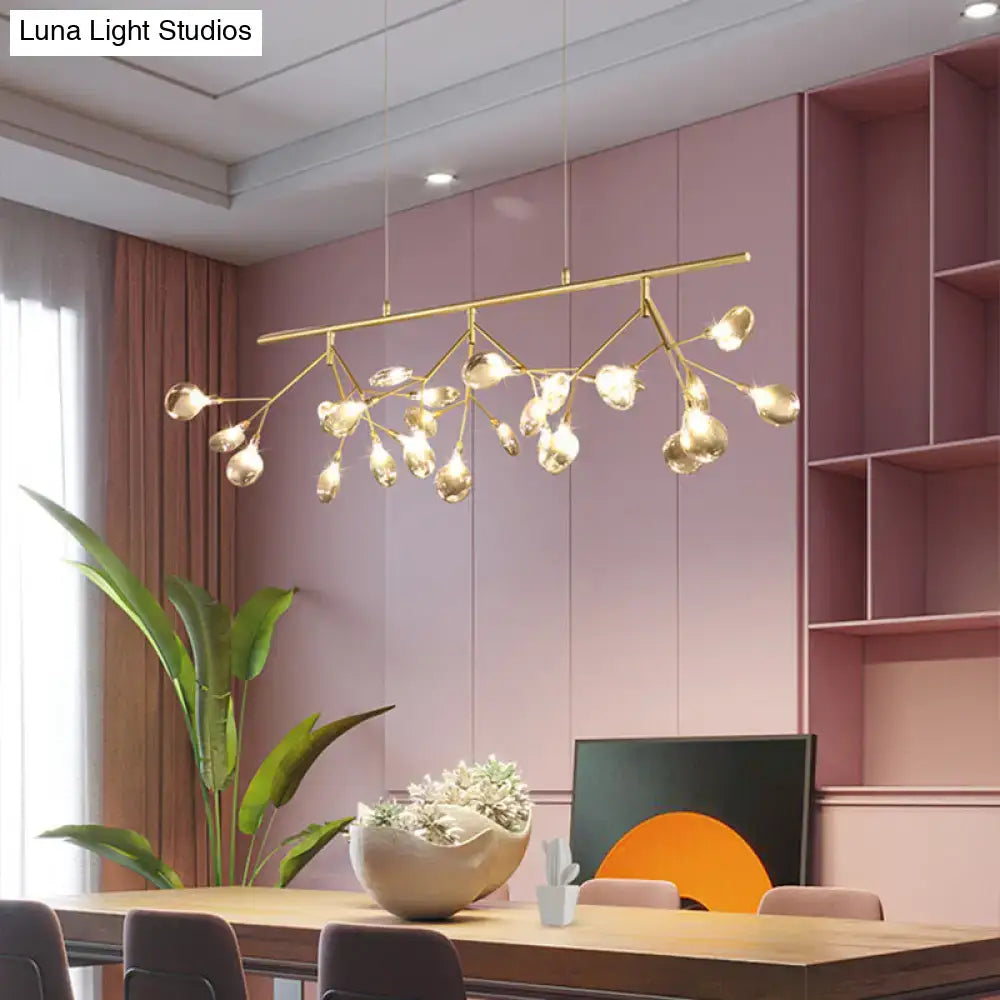 Gold-toned decorbites smoke grey glass firefly chandelier with branching arms and clear globe bulbs for dining room lighting
