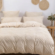Beige quilted duvet cover set with geometric embroidery and frayed texture in soft tufted microfiber by DecorBites