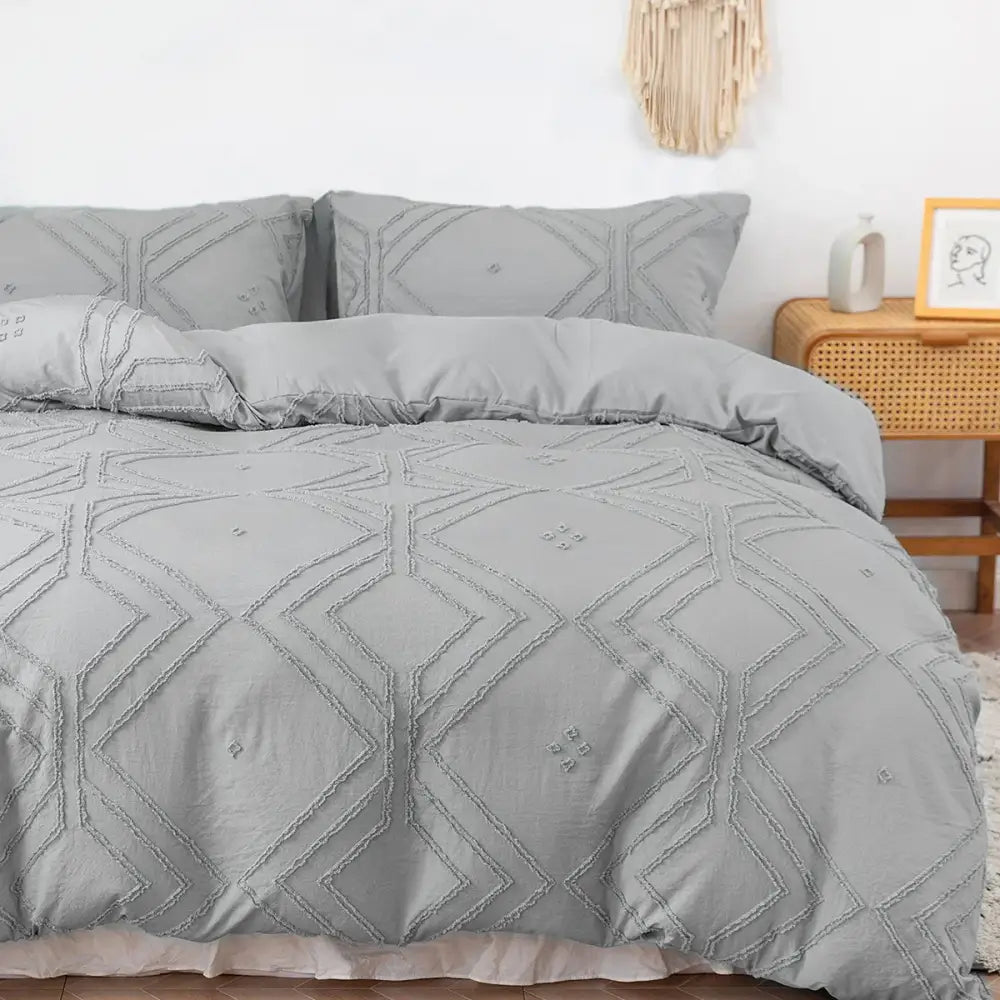 Gray quilted duvet cover set with geometric embroidery pattern made from soft tufted microfiber by DecorBites