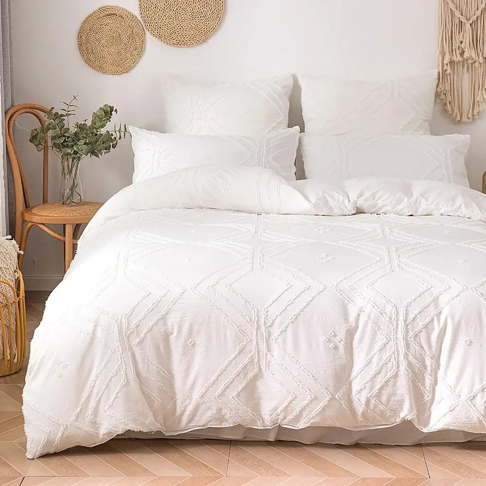 White quilted duvet cover set with geometric embroidery and frayed texture made of soft tufted microfiber