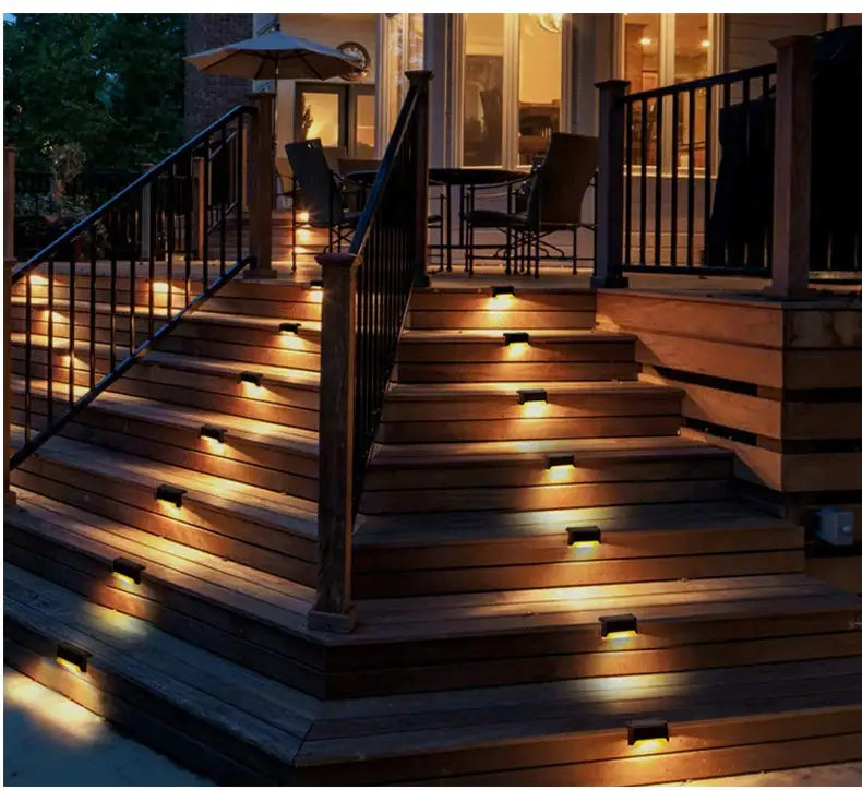 Warm-toned solar led lights embedded into wooden stairs for outdoor use from decorbites solar led outdoor set