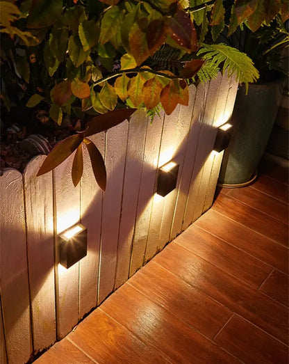 DecorBites™ solar led black square wall light with lamp beads providing warm focused outdoor illumination