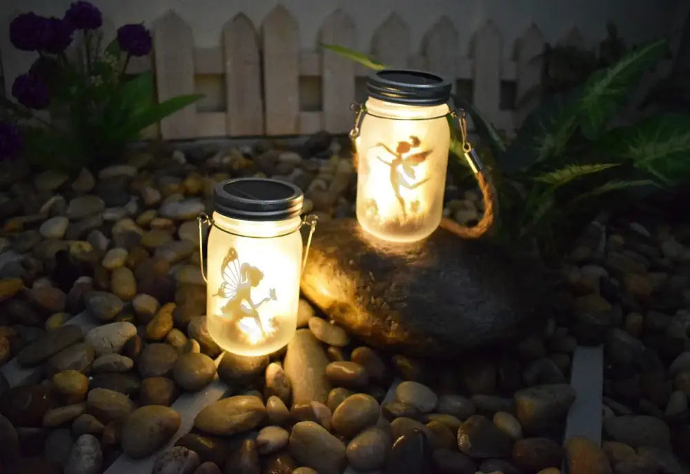 Decorbites™ solar mason jar lights with fairy silhouette glass jar lanterns featuring black lids and handles for garden decor
