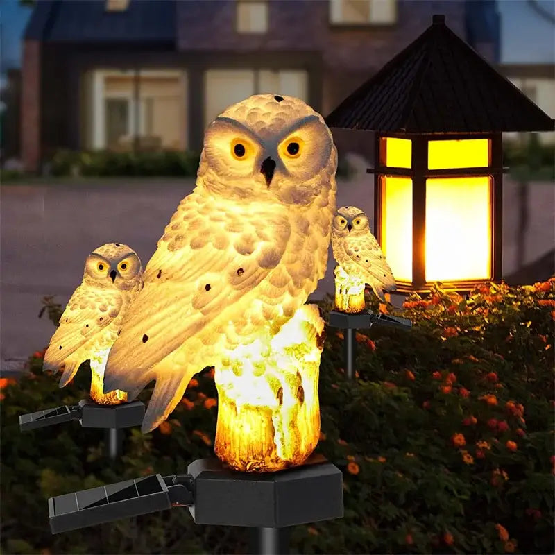 Decorbites™ solar owl garden light glowing white with detailed feathers and yellow eyes on black stake waterproof led
