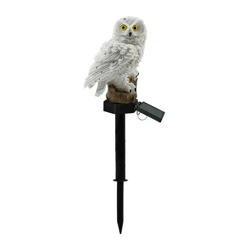 White owl-shaped solar owl garden light with yellow eyes detailed feather texture on black stake by decorbites
