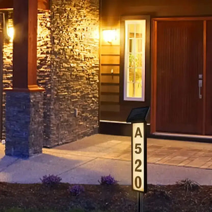 Decorbites™ sleek black solar powered led house number light displaying a520 in illuminated white numerals