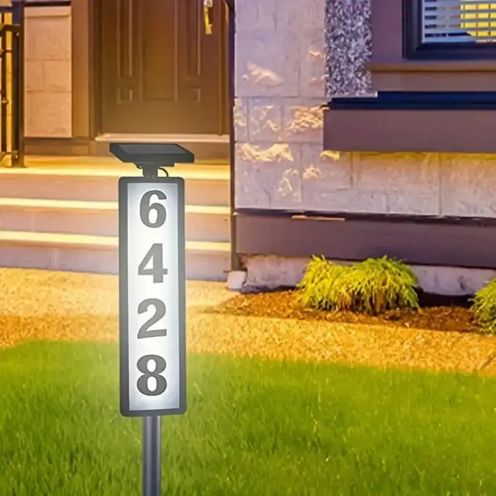 DecorBites solar powered led house number sign in black and white rectangular design displaying 6428