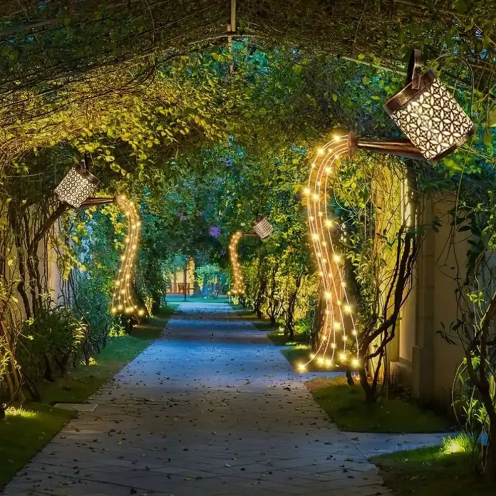 Golden string lights with intricate geometric cutouts in a lush garden archway for solar watering outdoor decor