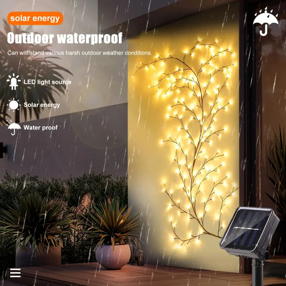 Warm yellow led decorbites solar willow vine light forming a decorative tree branch design for outdoor use