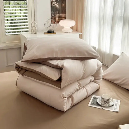 Beige and taupe two-toned solid color duvet cover set with soft brush fabric featuring a plush texture by DecorBites