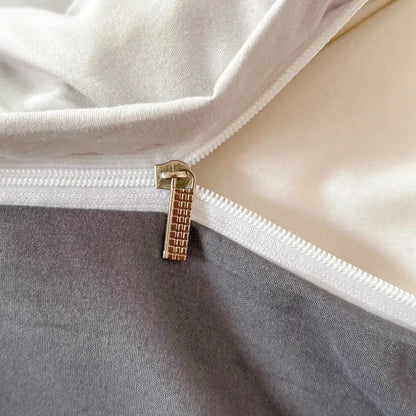 Gold-toned zipper pull with textured grid design on slider of decorbites™ solid color brush fabric duvet cover set