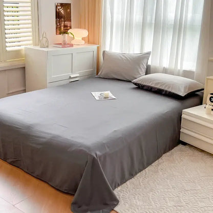 Gray solid color brush fabric duvet cover with smooth glossy finish and neatly tucked edges from decorbites bedding set