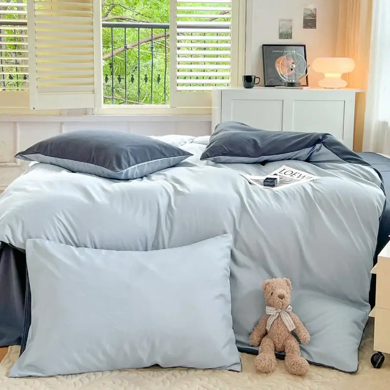 Decorbites™ solid color brush fabric bedding set features light blue satin-like sheets with matching pillows and a dark gray duvet cover