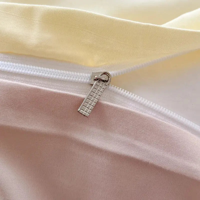 Silver-toned zipper pull with textured grid pattern on solid color brush fabric duvet cover from decorbites bedding set