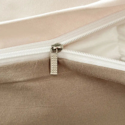 Silver-toned zipper pull with textured grid pattern on decorbites solid color brush fabric duvet cover set