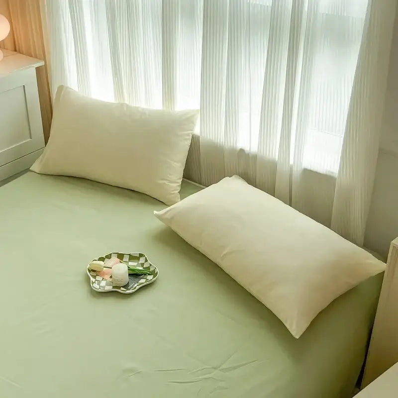 Soft mint green solid color brush fabric duvet cover set with two pillows and a checkered plate holding flowers