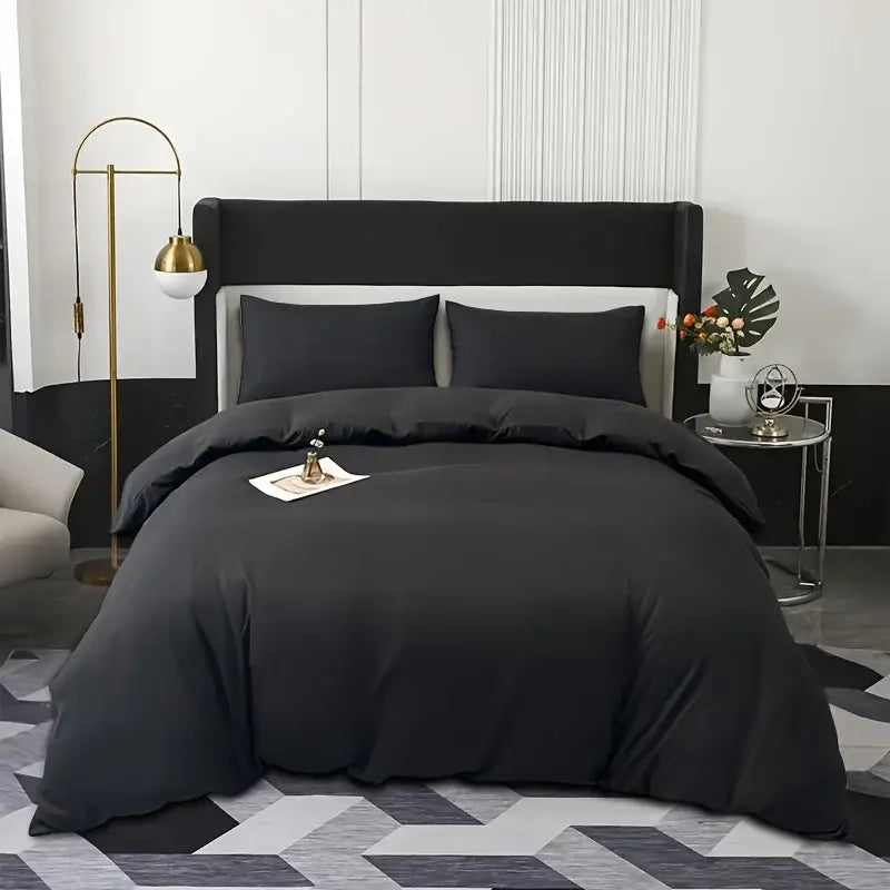 Black satin duvet cover set by decorbites with matching pillowcases featuring smooth luxurious texture and elegant drape
