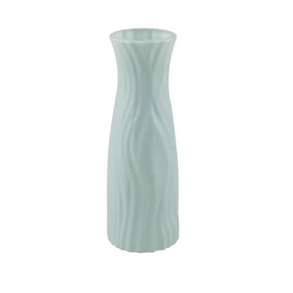 A sleek light green solid color plastic flower vase with smooth wavy texture for home decor by decorbites