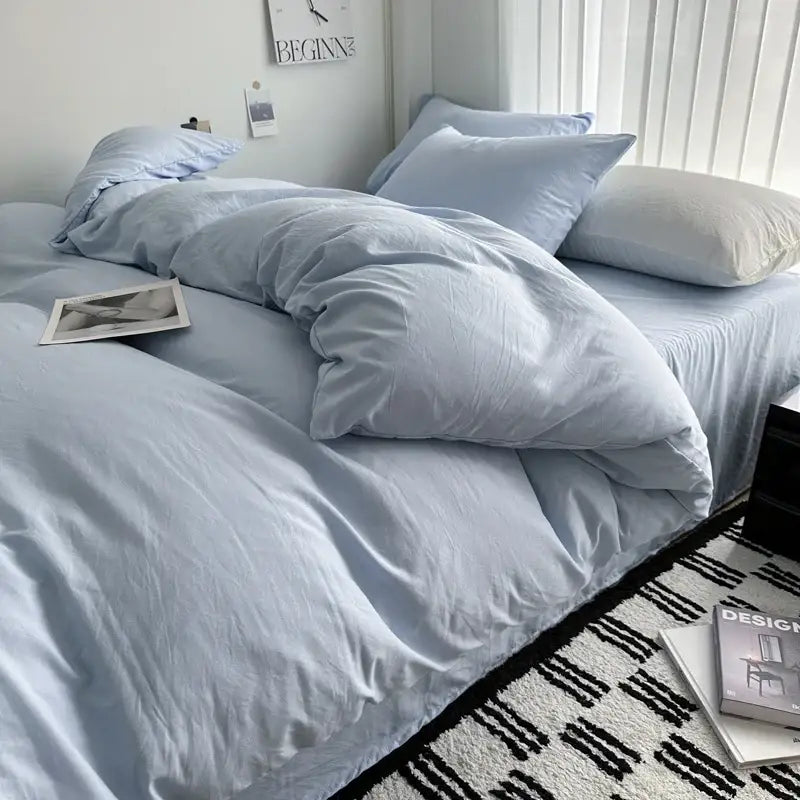 Light blue soft-textured solid cotton bedding set with duvet cover and matching pillows by decorbites in various sizes