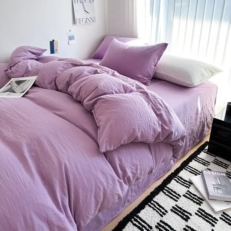 Purple quilted solid cotton bedding set with matching duvet cover and contrasting white pillow by DecorBites