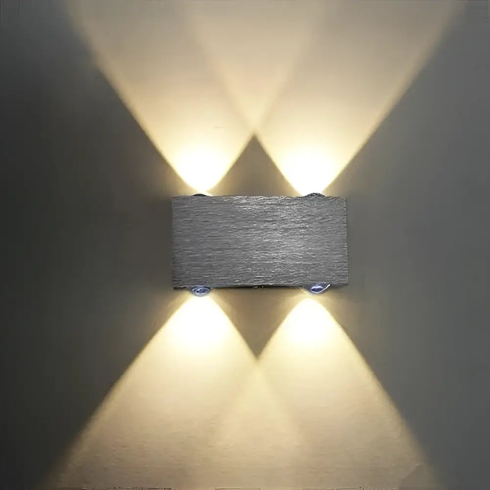 Gray rectangular DecorBites™ Sphera modern LED cube box wall sconces with textured stone-like finish and warm symmetrical lights