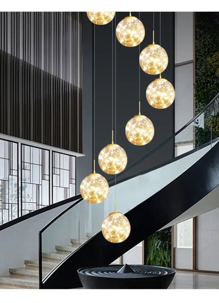 Golden spherical crystal ball chandelier light with intricate glowing patterns in a modern decorbites spiral design